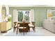 Modern dining area with stylish decor, sliding door and a contemporary light fixture at 10331 Gentle Rain Dr, Land O Lakes, FL 34638