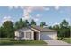 Charming single-story home with a well-manicured lawn and inviting front entrance at 10331 Gentle Rain Dr, Land O Lakes, FL 34638