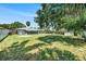 A spacious backyard view, surrounded by lush greenery and trees, perfect for Gathering activities at 105 N Comet Ave, Clearwater, FL 33765