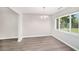 Dining room featuring light-colored walls and floors plus a large window at 105 N Comet Ave, Clearwater, FL 33765