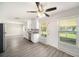 Bright kitchen with stainless steel appliances, granite countertops, and a view of the backyard at 105 N Comet Ave, Clearwater, FL 33765