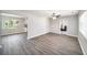 Open-concept living room with wood-look floors and lots of natural light at 105 N Comet Ave, Clearwater, FL 33765