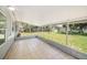 Enclosed patio area with tile floor, offering a versatile outdoor space for relaxation and entertainment at 105 N Comet Ave, Clearwater, FL 33765