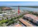 Aerial view of neighborhood, showcasing proximity to lake and nearby amenities at 10560 Lake Seminole Ter, Seminole, FL 33772