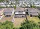 Aerial view of backyard, screened in pool, and privacy fence, surrounded by mature trees at 10560 Lake Seminole Ter, Seminole, FL 33772