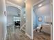 A cozy bathroom with a toilet, sink, light blue walls, and wood-look flooring, creating a comfortable space at 10560 Lake Seminole Ter, Seminole, FL 33772