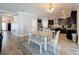 A modern dining area adjacent to the kitchen features a stylish table set and ample natural light at 10560 Lake Seminole Ter, Seminole, FL 33772