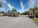 Gated entrance to a private community with landscaping at 10560 Lake Seminole Ter, Seminole, FL 33772