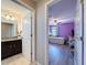 Hallway view of the bathroom vanity and sink on the left and bedroom on the right at 10560 Lake Seminole Ter, Seminole, FL 33772