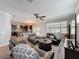 A well-lit open-concept living space seamlessly connects the living room, kitchen, and dining areas at 10560 Lake Seminole Ter, Seminole, FL 33772