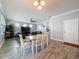 A spacious living room area with an open entryway, a ceiling fan, and plenty of natural light at 10560 Lake Seminole Ter, Seminole, FL 33772