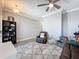 Comfortable living room with ceiling fan, neutral color palette, and ample natural light at 10560 Lake Seminole Ter, Seminole, FL 33772