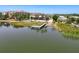An aerial view showcases the waterway, a private dock and pool at 10560 Lake Seminole Ter, Seminole, FL 33772