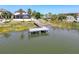 Scenic waterfront property with a private dock, perfect for enjoying peaceful moments by the water at 10560 Lake Seminole Ter, Seminole, FL 33772