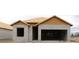 Home under construction featuring concrete block walls and roof framing, showcasing the building process at 10657 Crescent Creek Xing, Parrish, FL 34219