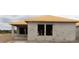 Unfinished exterior showing cinderblock construction, an unfinished roof, and window openings at 10657 Crescent Creek Xing, Parrish, FL 34219
