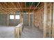 Interior view showcasing the framing of a new home, highlighting the structure and layout at 10657 Crescent Creek Xing, Parrish, FL 34219