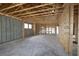 Interior view showcasing the framing of a new home, highlighting the structure and layout at 10657 Crescent Creek Xing, Parrish, FL 34219