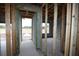 Interior view showcasing the framing of a new home, highlighting the structure and layout at 10657 Crescent Creek Xing, Parrish, FL 34219
