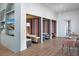 Modern lounge with comfortable booth seating, tables, chairs, and contemporary decor at 10657 Crescent Creek Xing, Parrish, FL 34219
