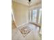 The entry has patterned tile flooring, a decorative glass door, and side windows, creating a welcoming space at 11014 Peking Pl, Tampa, FL 33624