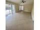 Spacious living area with tile floors, patio access, and plenty of natural light at 11014 Peking Pl, Tampa, FL 33624