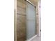 Modern tiled shower with glass door at 11014 Peking Pl, Tampa, FL 33624
