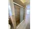Modern tiled shower with glass door and decorative tile accents at 11014 Peking Pl, Tampa, FL 33624