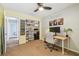 Cozy bedroom with organized closet, desk, and a view into the en-suite bathroom at 1111 Lakemont Dr, Valrico, FL 33594