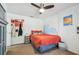 Cozy bedroom with warm colors, wave art, unique wall decor, and a ceiling fan at 1111 Lakemont Dr, Valrico, FL 33594