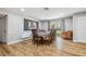 Cozy dining area with wood flooring and elegant decor with natural light at 1111 Lakemont Dr, Valrico, FL 33594