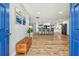 Spacious entryway with hardwood floors leading to a modern kitchen and living area at 1111 Lakemont Dr, Valrico, FL 33594