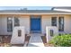 Inviting front entrance featuring double blue doors and unique exterior lighting at 1111 Lakemont Dr, Valrico, FL 33594