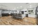 Open-concept kitchen with modern appliances and ample seating at the island at 1111 Lakemont Dr, Valrico, FL 33594