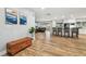 Stylish living space with sleek hardwood flooring and a modern kitchen in view at 1111 Lakemont Dr, Valrico, FL 33594