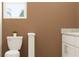Simple bathroom design with toilet, window, and vanity with granite countertop at 11118 E 65Th Ter, Palmetto, FL 34221