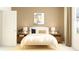 Inviting bedroom featuring a soft yellow color scheme, decorative artwork, and natural lighting at 11118 E 65Th Ter, Palmetto, FL 34221