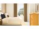 Bedroom features a comfortable bed, soft lighting, and a neutral color palette with white trim at 11118 E 65Th Ter, Palmetto, FL 34221