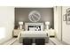 Stylish bedroom with a decorative basketball light, sporty decor, and sleek white furniture at 11817 Blue Diamond Trl, Parrish, FL 34219