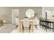 Elegant dining room featuring a wooden table with cream chairs and stylish décor for a refined ambiance at 11817 Blue Diamond Trl, Parrish, FL 34219