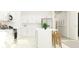 Modern kitchen with white cabinets, stainless steel appliances, and a center island with bar stools at 11844 Blue Diamond Trl, Parrish, FL 34219