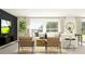 Modern living room featuring a comfortable sofa, stylish chairs, and contemporary decor at 11844 Blue Diamond Trl, Parrish, FL 34219