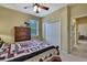 A bedroom with a wooden bed frame, dressers, and a ceiling fan at 12012 Cromwell Way, Spring Hill, FL 34609