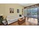 Comfortable living room with wood floors and view to the lanai at 12012 Cromwell Way, Spring Hill, FL 34609