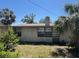 Backyard view of a house surrounded by trees at 12049 132Nd Ave, Seminole, FL 33778