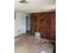 Cozy bedroom with wood paneling, ample natural light, and neutral flooring at 12049 132Nd Ave, Seminole, FL 33778