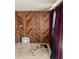 Cozy bedroom with wood paneling, ample natural light, and neutral flooring at 12049 132Nd Ave, Seminole, FL 33778