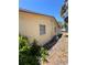 Side view of exterior of home with window at 12049 132Nd Ave, Seminole, FL 33778