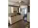 Well-lit kitchen featuring bright cabinets, a stainless sink, and ample counter space at 12049 132Nd Ave, Seminole, FL 33778