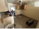Well-lit kitchen featuring bright cabinets, a stainless sink, and ample counter space at 12049 132Nd Ave, Seminole, FL 33778